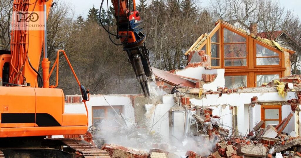 Demolition contractor operating excavator for building demolition in Sharjah UAE