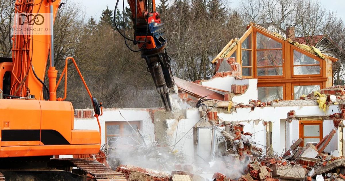 Demolition contractor operating excavator for building demolition in Sharjah UAE